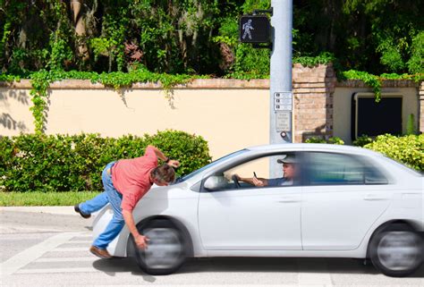 person run over by car|car chases pedestrian video.